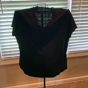 Black short sleeve shirt with cute detail in front.